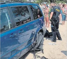  ?? CHRISTINE AYALA THE CANADIAN PRESS ?? No one was injured when a vehicle was driven on to Port Dover beach Saturday. The incident was posted on Facebook by an observer.