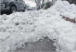  ?? BARRY GRAY THE HAMILTON SPECTATOR ?? A snow-covered sidewalk along Victoria Avenue North. The heavy, icy snow buildup, which will be difficult for homeowners to move, has forced pedestrian­s and people with mobility issues to venture onto the streets and into traffic.