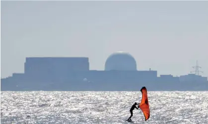  ?? ?? A windsurfer sails in front of the Sizewell B nuclear power plant in Suffolk. Photograph: Matthew Horwood/Getty Images