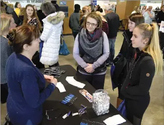  ?? Herald photo by J.W. Schnarr ?? Lesley Rode, a student program advisor, speaks to Teri Smith, Madison Krisjanson, and Camryn Smith on Saturday at the University of Lethbridge Open House. There was a large turnout for the event.