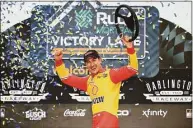  ?? James Gilbert / Getty Images ?? Joey Logano celebrates after winning the NASCAR Cup Series Goodyear 400 at Darlington Raceway on Sunday.
