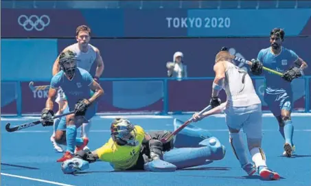  ?? GETTY IMAGES ?? India keeper PR Sreejesh saves a shot from Belgium’s John Dominique M Dohmen during Tuesday’s semi-final in Tokyo.