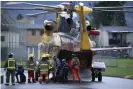  ?? Photograph: Jonathan Hayward/AP ?? Search and rescue personnel help flood evacuees disembark from a helicopter in Agassiz, British Columbia, on Monday.