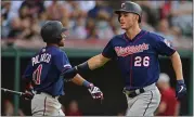  ?? DAVID DERMER — THE ASSOCIATED PRESS ?? The Twins’ Max Kepler, right, is congratula­ted by Jorge Polanco after Kepler hit the first of his two home runs off Indians pitcher Trevor Bauer on Saturday.