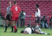  ??  ?? Left Vinnie Jones inadverten­tly ushers in a new Welsh era Right Giggs and Wales lose to the mighty Leyton Orient Below and bottom It couldn’t be said that Gould wasn’t friendly