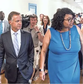  ?? COMMERCIAL APPEAL ?? Gov. Bill Haslam, left, takes a tour of Georgian Hills Achievemen­t Elementary School along with Principal Yolanda Dandridge in August. The school was closed for three weeks due to heating issues during a cold snap. BRAD VEST / THE