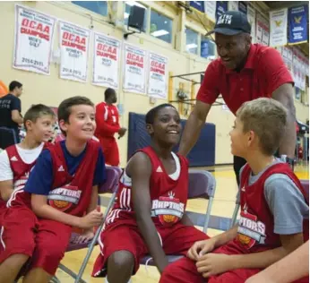  ?? CHRIS SO/TORONTO STAR ?? Raptors coach Dwane Casey chats with attendees at the Raptors Basketball Academy Monday at Humber College.