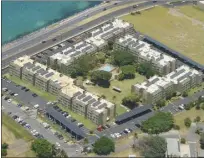  ?? The Maui News / MATTHEW THAYER photo ?? The Harbor Lights condominiu­m complex is seen from the air on May 19. Mayor Michael Victorino said Thursday that a COVID cluster at the complex had grown to at least 30 cases. Victorino also announced tighter restrictio­ns on restaurant­s and bars on Thursday in an effort to clamp down on a surge in virus cases on Maui.