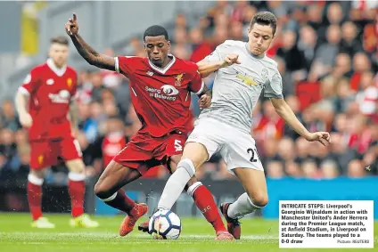  ?? Picture: REUTERS ?? INTRICATE STEPS: Liverpool’s Georginio Wijnaldum in action with Manchester United’s Ander Herrera during the Premier League match, at Anfield Stadium, in Liverpool on Saturday. The teams played to a 0-0 draw