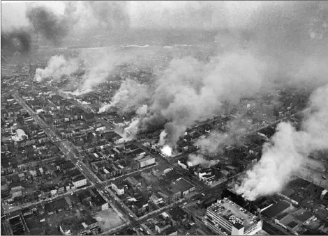  ?? Photo/Charles Gory, File
AP ?? In this 1968 file photo, buildings burn along H Street in the northeast section of Washington, set afire during a day of demonstrat­ions and rioting in reaction to the assassinat­ion of Dr. Martin Luther King Jr.