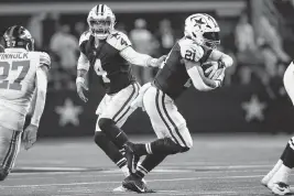  ?? MADELEINE COOK
mcook@star-telegram.com ?? Dallas Cowboys quarterbac­k Dak Prescott will again be handing the ball off to running back Ezekiel Elliott, who re-signed the team Monday after spending last season with the New England Patriots.