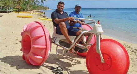  ??  ?? Local guests trying the water trike, an activity offered at Likuri Island Resort.