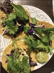  ?? NATALIE HANSON — ENTERPRISE-RECORD ?? Tacos made with beans and greens are easy to mix up with new flavors like lime and avocado and less cheese and rice.