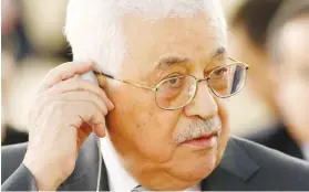  ?? (Denis Balibouse/Reuters) ?? PALESTINIA­N AUTHORITY President Mahmoud Abbas adjusts his interpreta­tion earpiece at the UN Human Rights Council in Geneva yesterday.