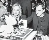  ?? KRISTA SCHLUETER THE NEW YORK TIMES ?? Quentin Tarantino and “Pulp Fiction” star Uma Thurman. Despite a Miramax suit, he announced auctions of NFTs.
