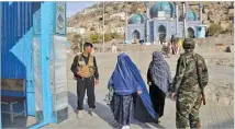  ??  ?? RAHMAT GUL/AP In this Oct. 30, 2018 photo Afghan security forces guard the gate of the Karti Sakhi Shrine in Kabul, Afghanista­n.