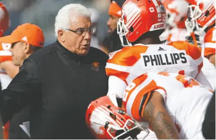  ?? CP FILE PHOTO ?? B.C. Lions head coach Wally Buono talks to Ryan Phillips during an Oct. 8 game against the Winnipeg Blue Bombers in Winnipeg.