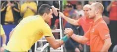  ??  ?? Australia’s Nick Kyrgios shakes hands with Belgium’s Steve Darcis after the match. — AFP photo
