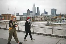  ?? Reuters ?? People take a walk on the Millennium Bridge in London.