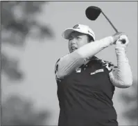  ?? The Associated Press ?? EARLY LEADER: China’s Shanshan Feng drives off No. 13 en route to the early first-round lead in the U.S. Women’s Open Thursday.