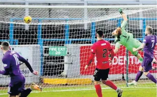  ??  ?? Goal Albion’s Andy Ryan watches the ball loop over Elgin keeper Thomas Mchale