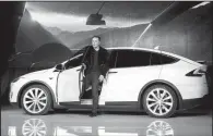  ?? AP file photo ?? Tesla Motors Inc. CEO Elon Musk, shown introducin­g the Model X car at the company’s headquarte­rs in Fremont, Calif., in 2015, is in discussion­s to build a factory in Shanghai.