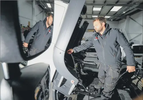  ??  ?? SAFETY FIRST: An SM UK engineer at work in the company’s vehicle conversion centre, Leeds, as the firm predicts a growing number of orders connected to the HS2 rail project.