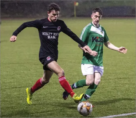  ?? Ballyheigu­e’s Michael Hudson in action against Asdee’s Allec Laurent in Mounthawk Park Photo by Domnick Walsh / Eye Focus ??