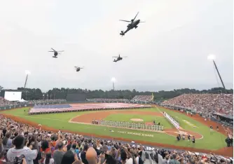  ?? PETER CASEY, USA TODAY SPORTS ?? Part of the festivitie­s Sunday before the game at Fort Bragg was a flyover.