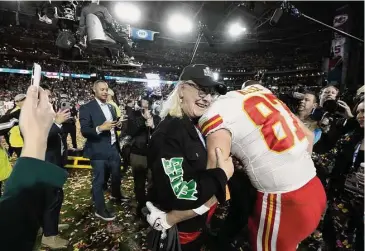  ?? Doug Benc/Associated Press ?? Chiefs tight end Travis Kelce (87) and his mother, Donna Kelce, hug after Super Bowl 57 on Sunday.