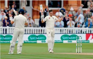  ?? AFP ?? Chris Woakes (right) made the most of the opportunit­y to hit his maiden Test hundred. —