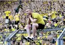  ?? Photograph: Mareen Meyer/EPA ?? A dejected Dortmund fan after the match.