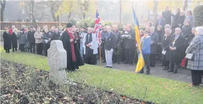  ?? THE town’s Ukrainian community have marked the 85th anniversar­y of Stalin’s genocidal famine with a ceremony in the memorial gardens.
Community and religious figures were joined by Mayor Coun Mohammed Zaman and Tony Lloyd MP for the memorial service on S ?? ●●Rochdale’s Ukrainian community commemorat­es the ‘Holodomor’