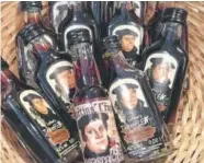  ??  ?? A basket of Martin Luther-branded liquor. From May to November, millions of visitors are expected to attend more than 2,000 events throughout Germany honoring Luther's legacy.