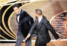  ?? MYUNG CHUN/LOS ANGELES TIMES TNS ?? Will Smith slaps Chris Rock onstage during the show at the 94th Academy Awards , March 27, 2022.