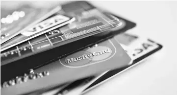  ??  ?? Store credit cards come with an average interest rate of 25 per cent. — WP-Bloomberg photo