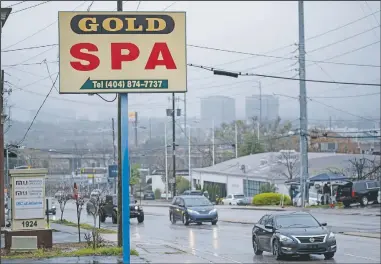  ?? (AP/Ben Gray) ?? A sign for the Gold Spa massage business in Atlanta, the day after multiple people were killed at three massage spas in the Atlanta area. On Friday, The Associated Press reported on stories circulatin­g online incorrectl­y asserting on Tuesday hours before police say Robert Aaron Long, 21, killed eight people at three Atlanta-area massage businesses, he posted on his Facebook that China was engaged in a “COVID coverup” and “AMERICANS NEED TO FIGHT BACK AGAINST CHINA, NOW.” But the post is not authentic.