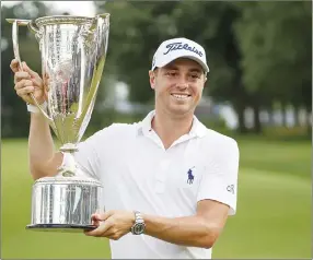  ?? Chicago Tribune/tns ?? Justin Thomas poses with the Wadley Cup after winning the BMW Championsh­ip at Medinah Country Club.