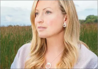  ??  ?? Renowned garden designer Leonie Cornelius wears a Croi Sliogan sterling silver pendant by awardwinni­ng Sligo jewellery designer Martina Hamilton.