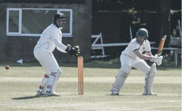  ??  ?? Shields opener Luke Elliott batting against Littletown, watched by wicketkeep­er Tom Nicholson, at South Shields Cricket Club on Saturday.