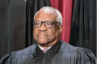  ?? J. Scott Applewhite / Associated Press ?? Associate Justice Clarence Thomas was in his mid-40s and in his third year on the nation’s highest court when he paid off the last of his debt from his time at Yale Law School.