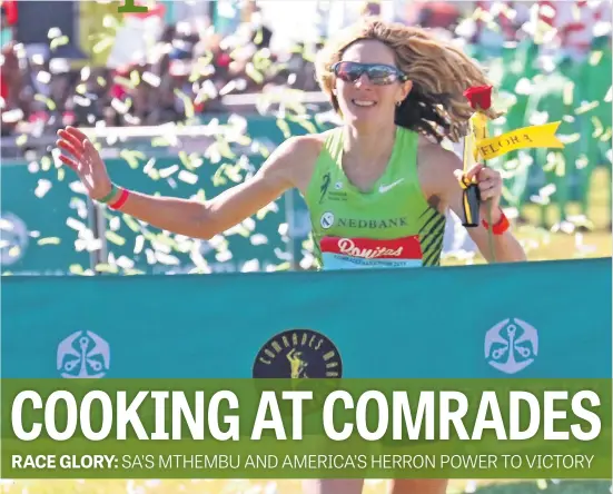  ?? Picture: Gallo Images ?? DELIGHTED. American Camille Herron celebrates as she crosses the finish line to win the women’s race at the Comrades Marathon in Pietermari­tzburg yesterday.