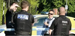  ??  ?? Police at the scene in Billinge where a murder probe has been launched