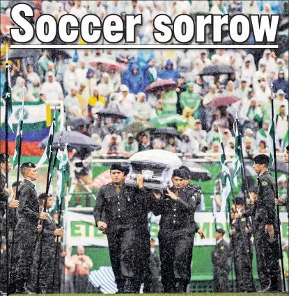  ??  ?? BRAZIL MOURNS: Soldiers carry the casket of one of the members of Chapecoens­e soccer club who died in a plane crash Monday. Tens of thousands of people turned out Saturday at the team’s stadium in the city of Chapeco.