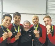  ?? COURTESY OFMATTHEWP­ORTER ?? U.S. Olympic Fencing Team armorer Matthew Porter, middle, lost his home and business in the Clayton fire.