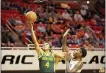  ?? BRODY SCHMIDT — THE ASSOCIATED PRESS ?? Baylor’s Te’a Cooper (4) shoots at the basket while under pressure from Oklahoma State’s Natasha Mack (4) during the first half in Stillwater, Okla., on Saturday.