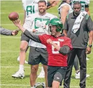  ?? Seth Wenig/Associated Press ?? New York Jets quarterbac­k Aaron Rodgers throws during a drill at the team’s training facility Tuesday in Florham Park, N.J.