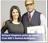  ??  ?? Richard Singleton picks up award from NBC’s Darlene Rodriguez.