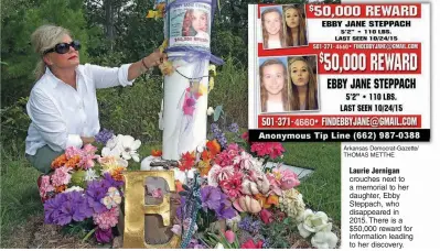  ?? Arkansas Democrat-Gazette/ THOMAS METTHE ?? Laurie Jernigan crouches next to a memorial to her daughter, Ebby Steppach, who disappeare­d in 2015. There is a $50,000 reward for informatio­n leading to her discovery.