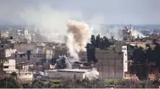  ?? AFP ?? Smoke rises following a regime air strike in the rebel-held town of Hamouria in Eastern Ghouta.